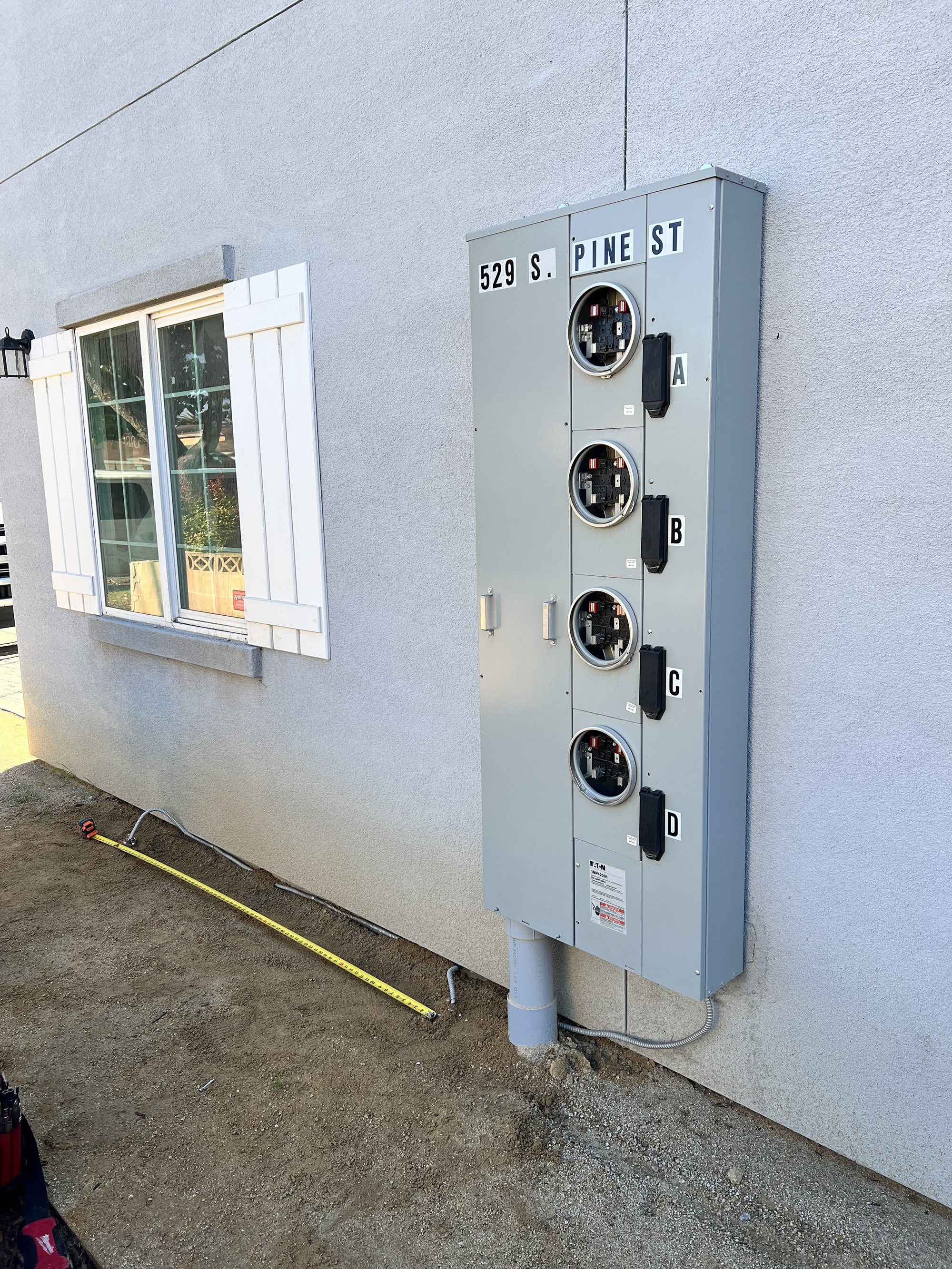 Four-unit meter stack multi-tenant commercial electrical panel SLO County CA MAG Electric