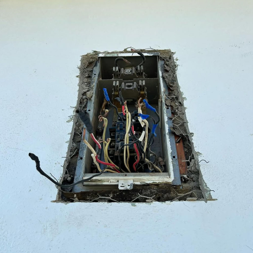 Licensed electrician performing precision electrical panel wiring upgrade in Santa Maria CA